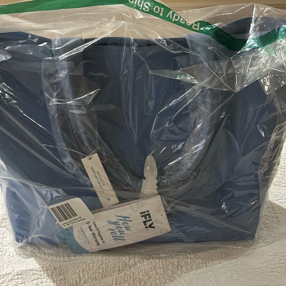 I Fly Weekender tote. New in packaging. Ice Blue.